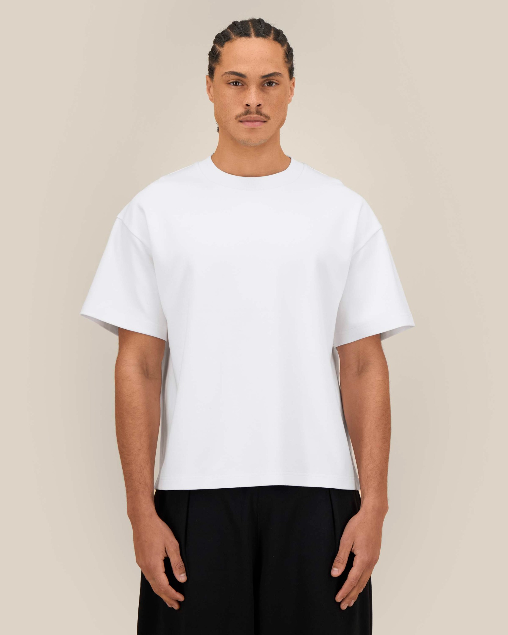 Oversized white T-shirt: wide sleeves, dropped shoulders and boxy fit